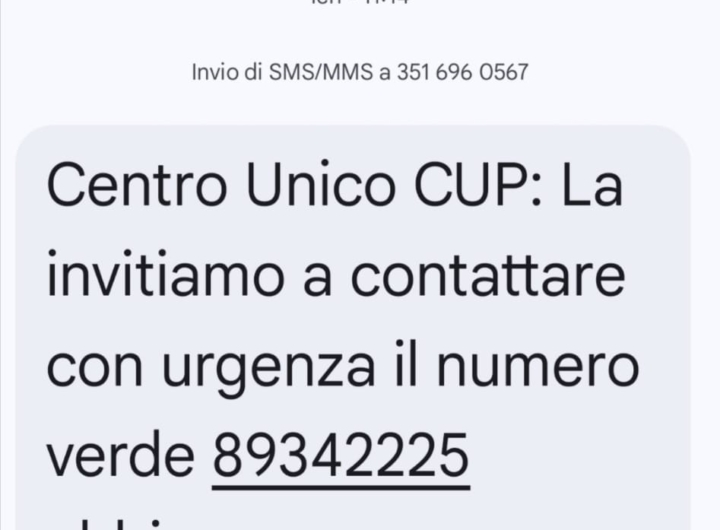 Telefono cellulare con messaggio SMS di truffa CUP e simbolo di allarme.